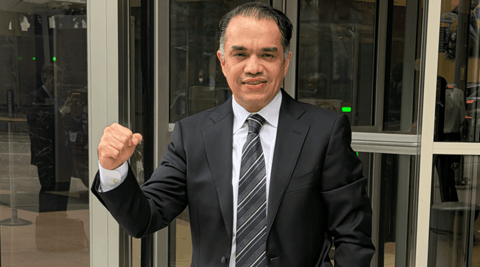 Alexandro Rovirosa Martinez raises his fist outside a Houston courthouse after his acquittal