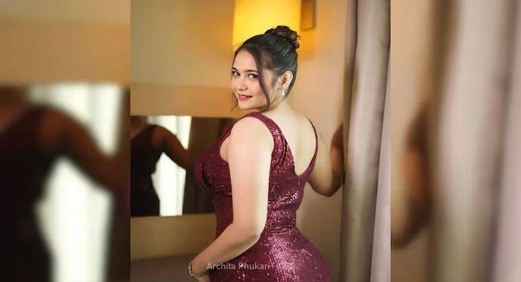 Archita Phukan aka Babydoll Archi posing in a sparkling maroon gown, the viral Instagram influencer from Assam