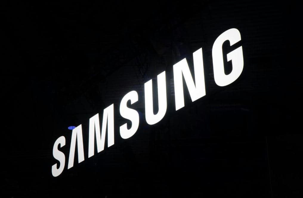 Samsung logo illuminated on building exterior representing global electronics brand