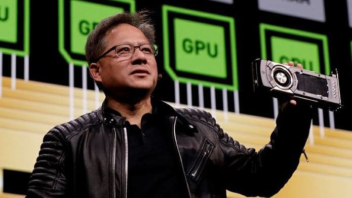 A technology leader Jensen Huang presenting on stage, highlighting advancements in AI and computing